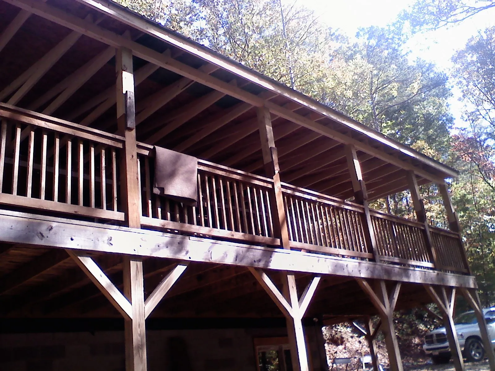 Timber framing under a new elevated porch and deck — Roof Leak Repair in Houlton by Roofing Brothers
